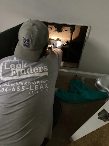 Technician inspecting pipes