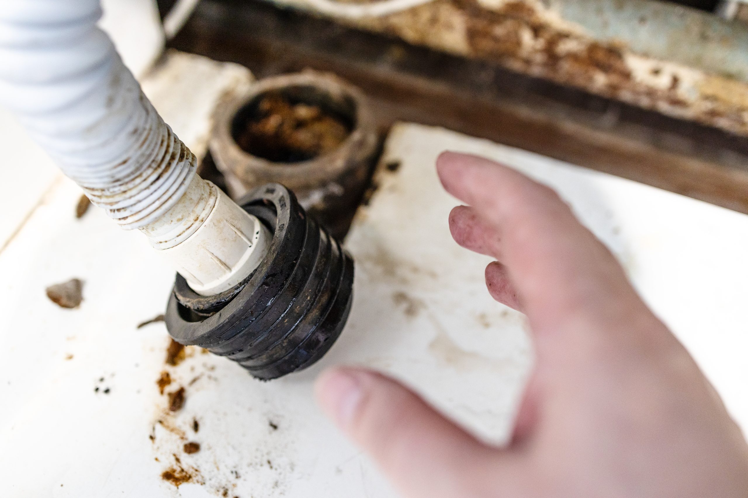 A clogged drain pipe connection